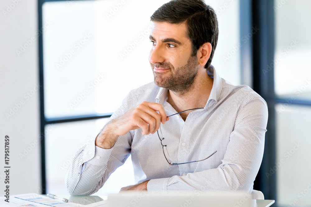 Naklejka premium Pensive businessman at office