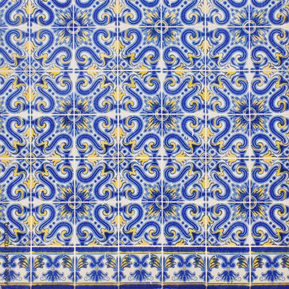 Traditional portuguese tiles azulejo, Blue and yellow azulejos on the building's exterior in Lisbon, Portugal