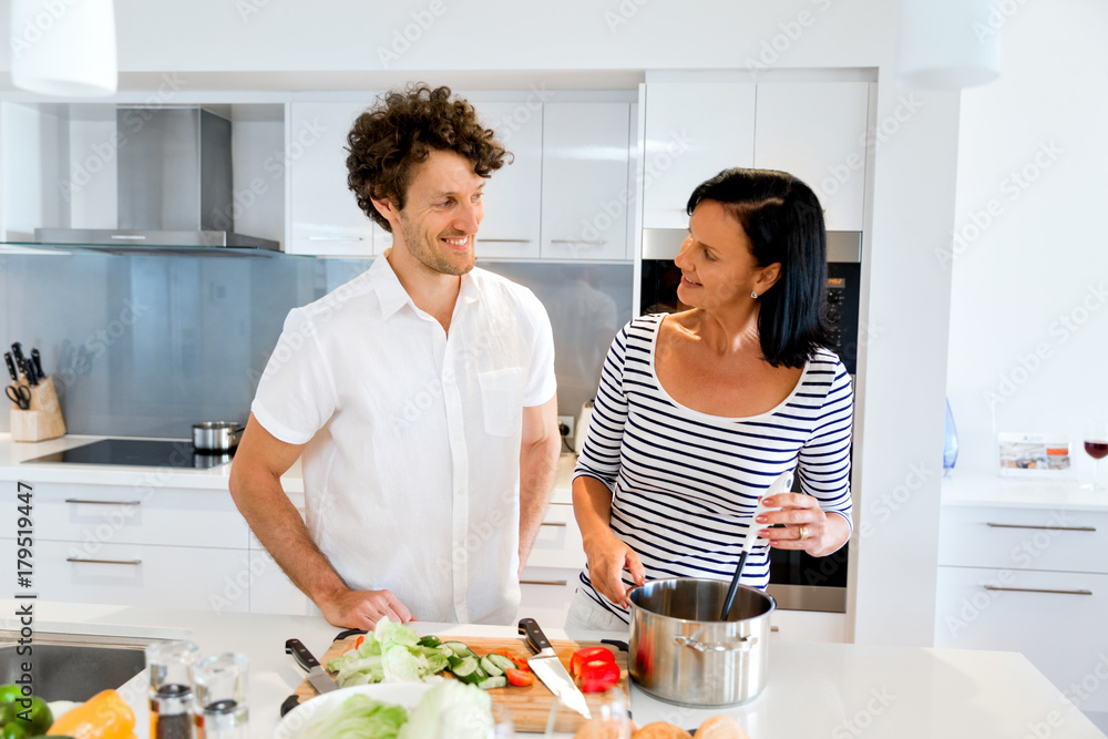 Couple cooking together at home