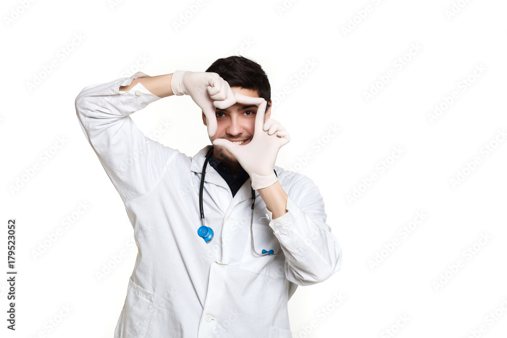 beautiful young doctor in a dressing gown with a stethoscope on a white background in the studio beautiful young doctor in a dressing gown with a stethoscope on a white background in the studio