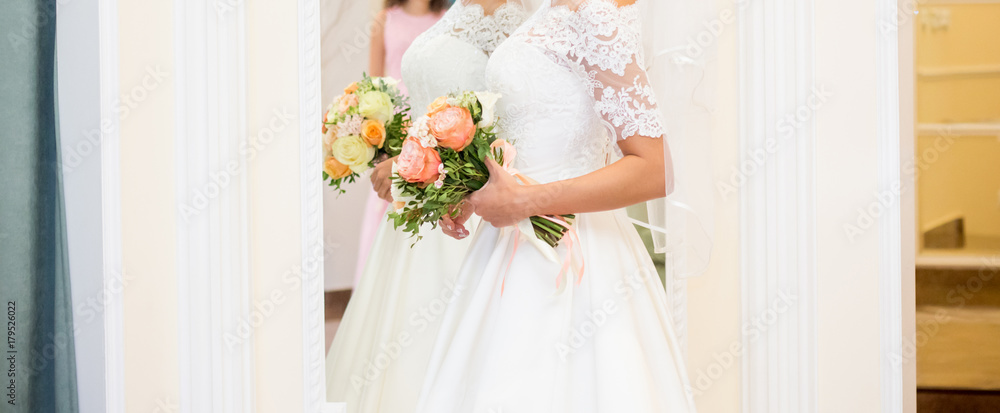 The bride with a wedding bouquet The bride with a wedding bouquet