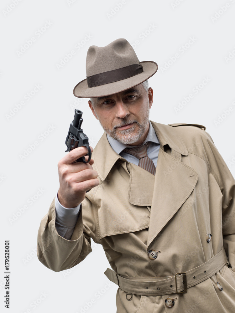 Fototapeta premium Retro spy agent with revolver