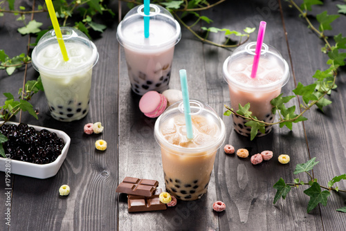 Фотография Milky bubble tea with tapioca pearls in plastic cup