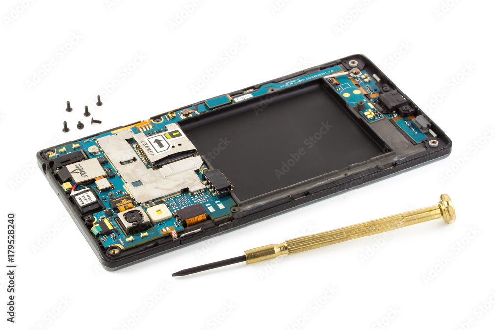 Disassembly of smartphone showing electrical board inside, fixing phone with screwdriver Disassembly of smartphone showing electrical board inside, fixing phone with screwdriver