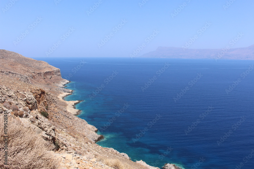 Blue Mediterranean Sea and Rodopos peninsula, taken from the Balos peninsula, near Kissamos in Chania prefecture, Crete Island, Greece.