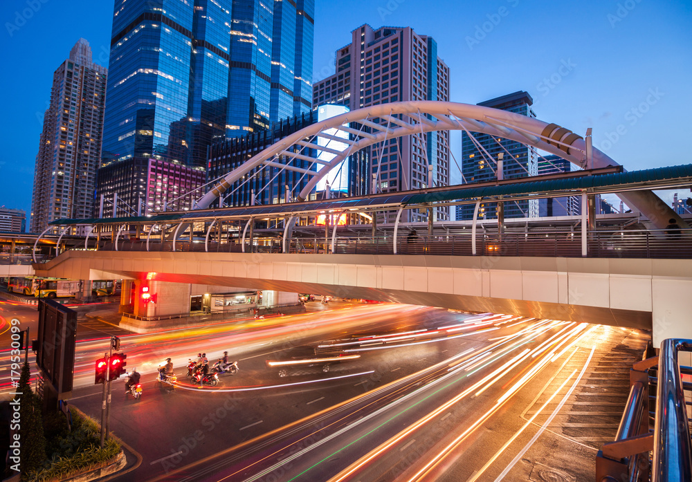 Chong Nonsi Station pedestrain walk path located in Bangkok Downtown, cityscape with long exposure effect during sunset