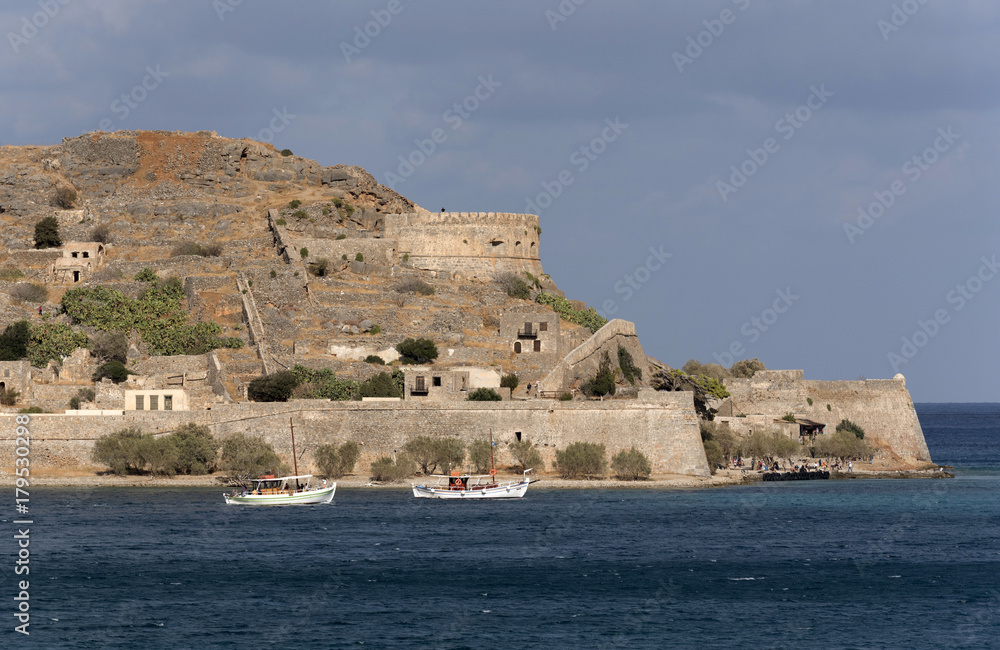 Overview of Spinalonga Island the historic leper colony and Venetian fortress. Lasithi, Crete Greece. October 2017 Overview of Spinalonga Island the historic leper colony and Venetian fortress. Lasithi, Crete Greece. October 2017