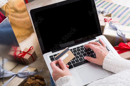 Woman shopping online with a credit card