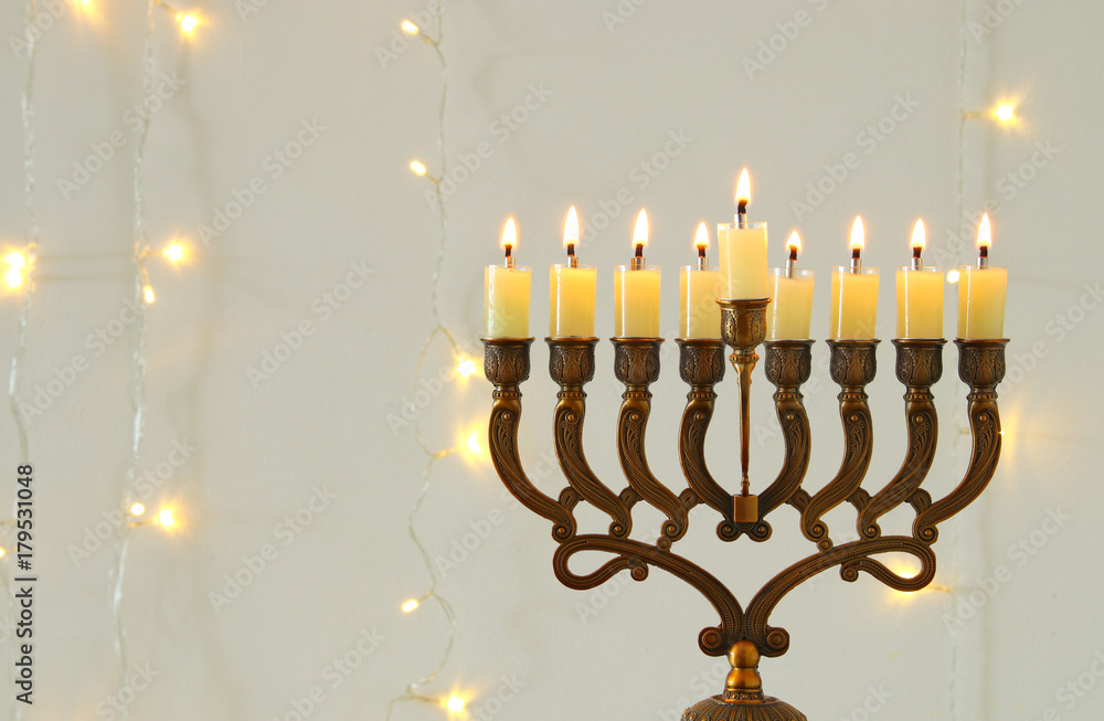 image of jewish holiday Hanukkah background with menorah (traditional candelabra) image of jewish holiday Hanukkah background with menorah (traditional candelabra)