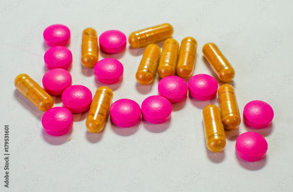 Pink and gold medicine pills Pink and gold medicine pills