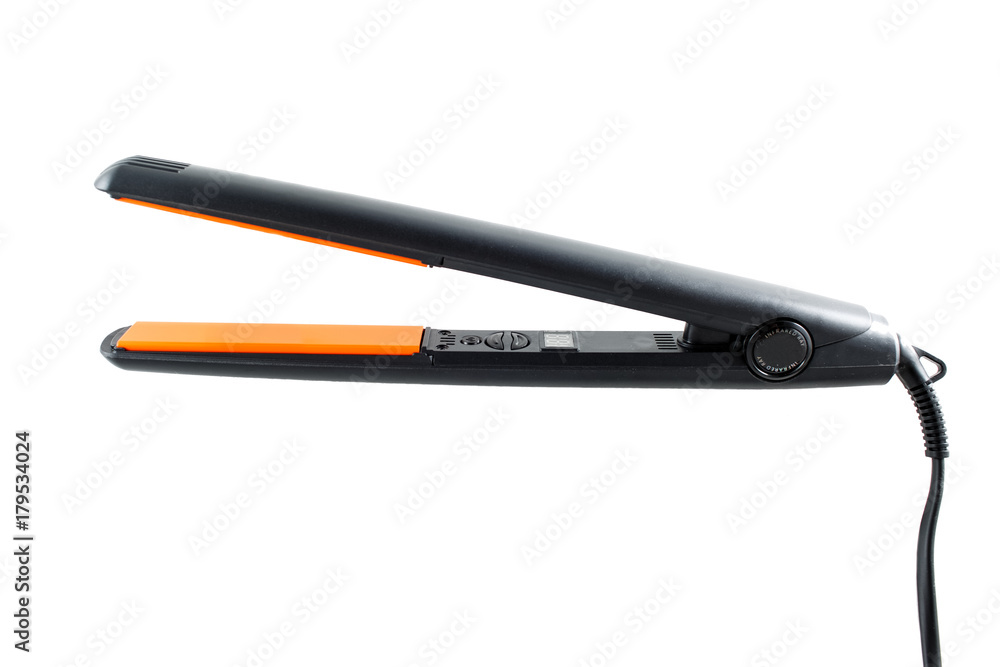 Black and orange hair straightener isolated on white background Black and orange hair straightener isolated on white background