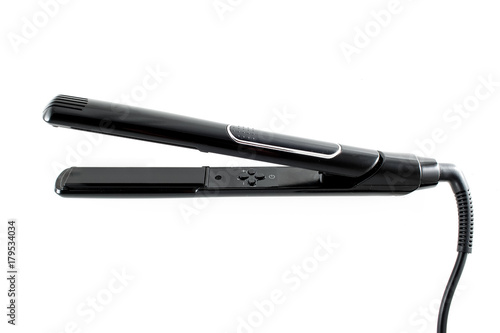 Black hair straightener isolated on white background