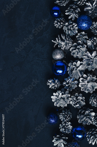 Fototapeta Naklejka Na Ścianę i Meble -  dark christmas background with cones