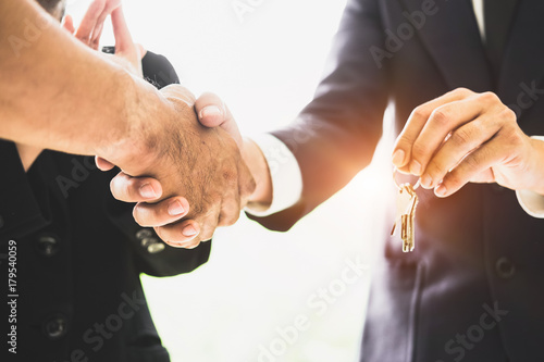 Wall Mural Agent and customer meeting and handshaking after good deal for buy house