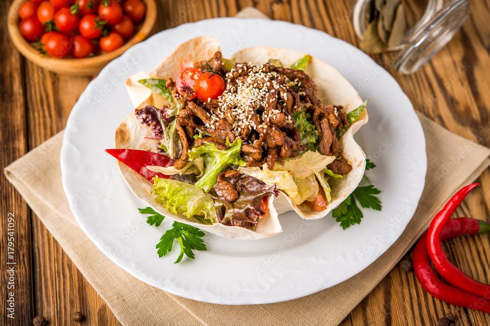 fried chicken meat with vegetables in pita bread fried chicken meat with vegetables in pita bread