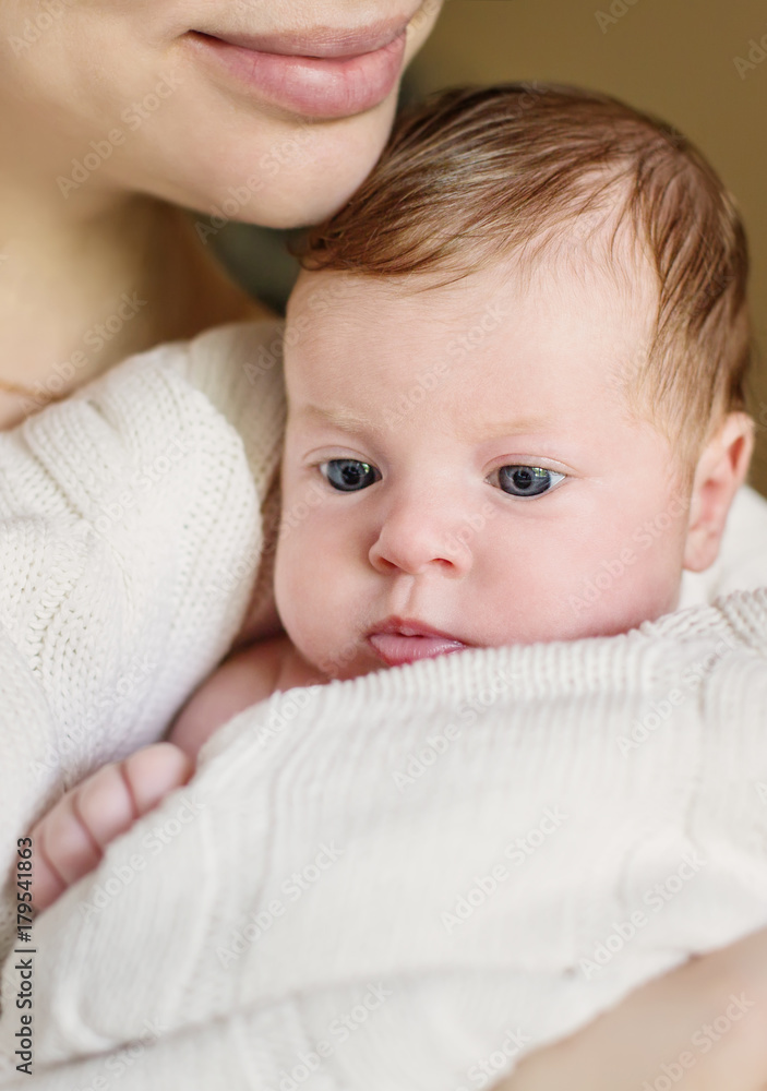 Happy mother holding a newborn baby Happy mother holding a newborn baby