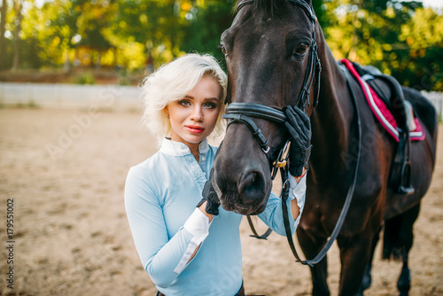 Female jockey and horse, horseback riding