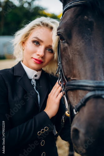 Blonde woman with horse, horseback riding