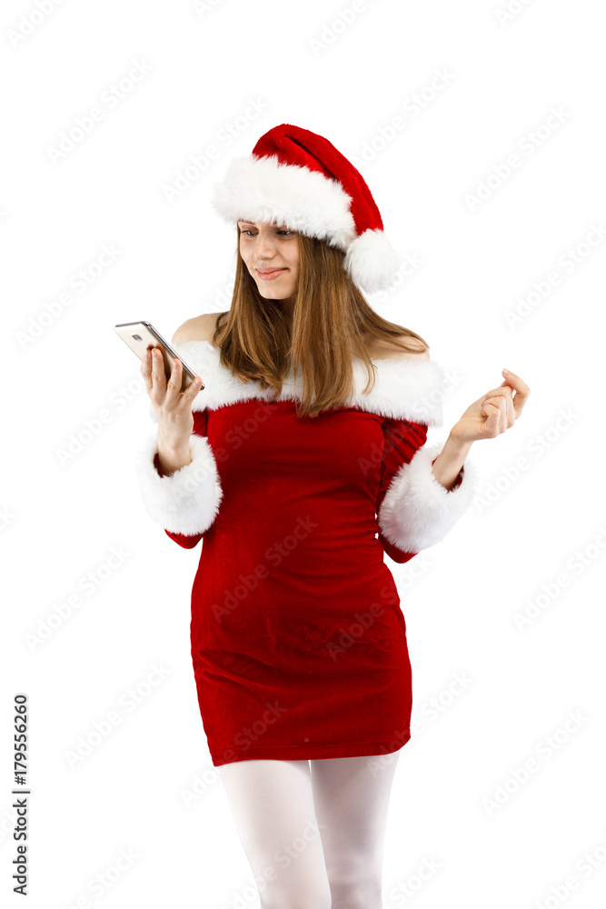 Beautiful woman in Santa Claus clothes using smartphone on white background Beautiful woman in Santa Claus clothes using smartphone on white background