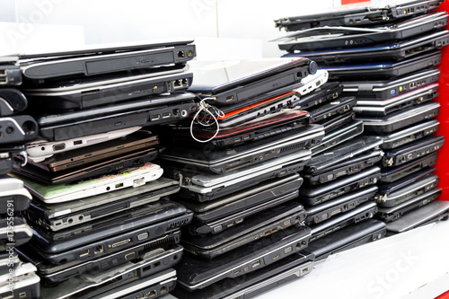 Stack of old, broken and obsolete laptop computer for repair