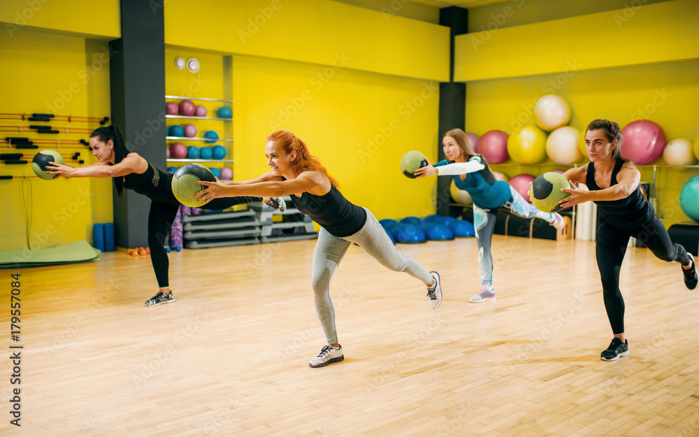 Women group with balls in motion, fitness workout
