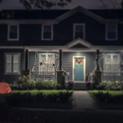 Seasonal Halloween House Lights Decoration at night, outdoor blurred defocused view