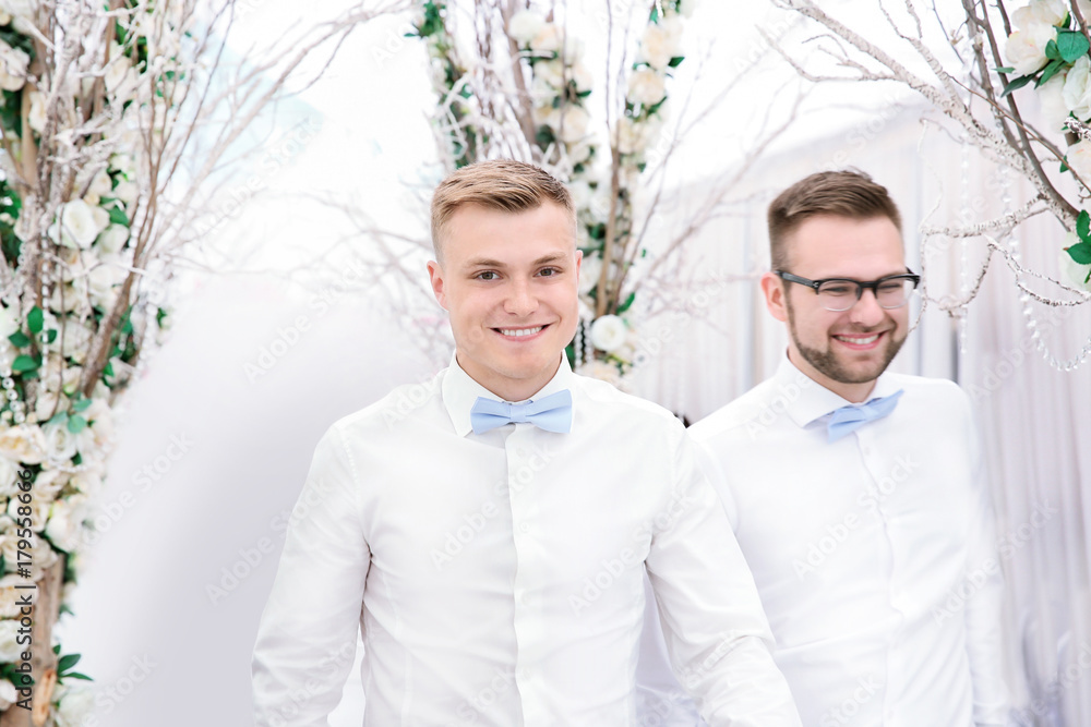 Young handsome best men on wedding day, indoors Young handsome best men on wedding day, indoors
