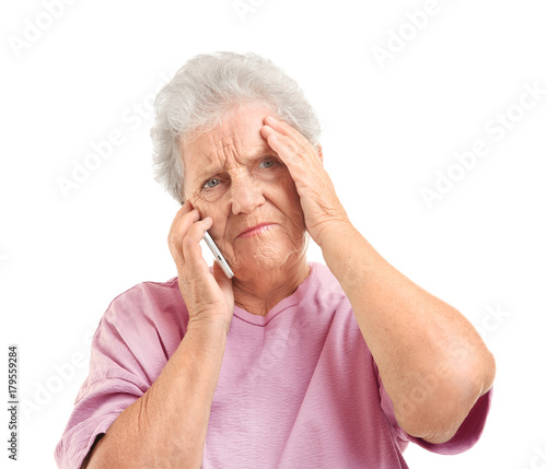 Elderly woman speaking on c...