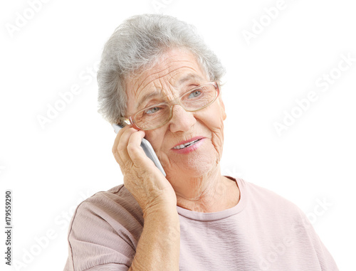 Elderly woman speaking on c...