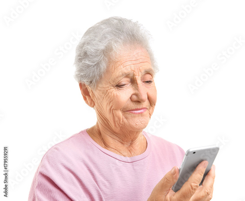 Elderly woman using cell phone, isolated on white