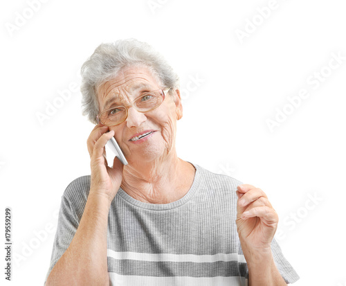 Elderly woman speaking on c...
