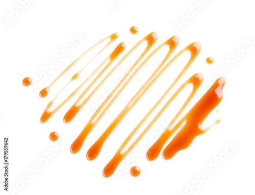 Delicious caramel sauce on white background