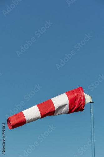windsock in front of blue sky