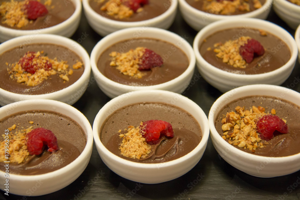 chocolate Pudding with raspberries in white cup chocolate Pudding with raspberries in white cup