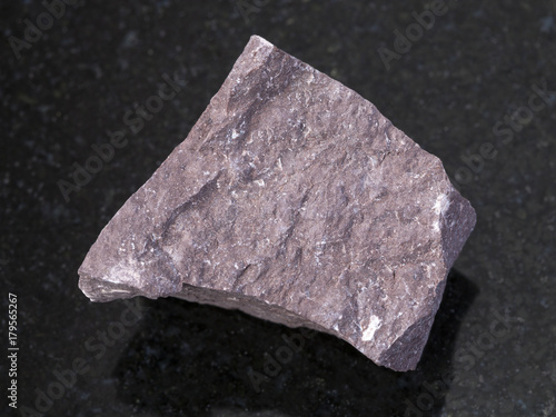 rough Aleurolite stone on dark background