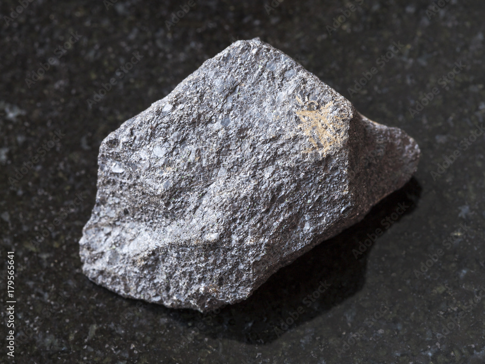 raw chromite stone on dark background raw chromite stone on dark background