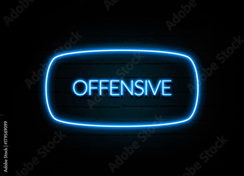 Offensive  - colorful Neon Sign on brickwall photo