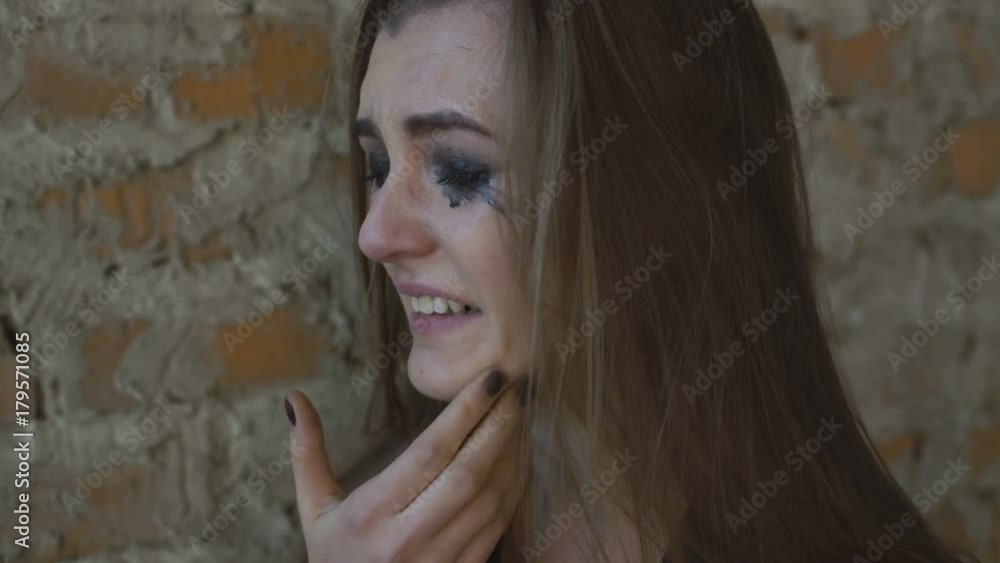 Beautiful sad woman crying in the building 4K Beautiful sad woman crying in the building 4K