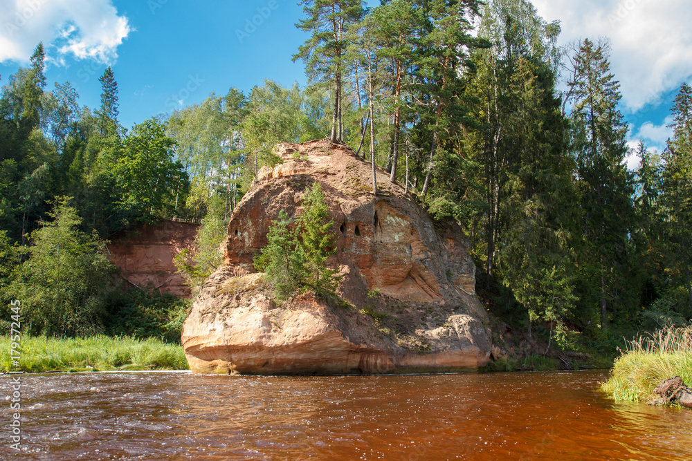 The Zvartes Rock is one of the most popular and scenic sandstone outcrops in Latvia. It is located on the left bank of the Amata River in the Gauja National Park.