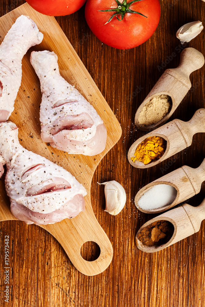 Raw chicken legs with spices Raw chicken legs with spices