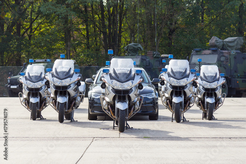 german feldjaeger, military police motorcycles and vehicles stands in formation photo