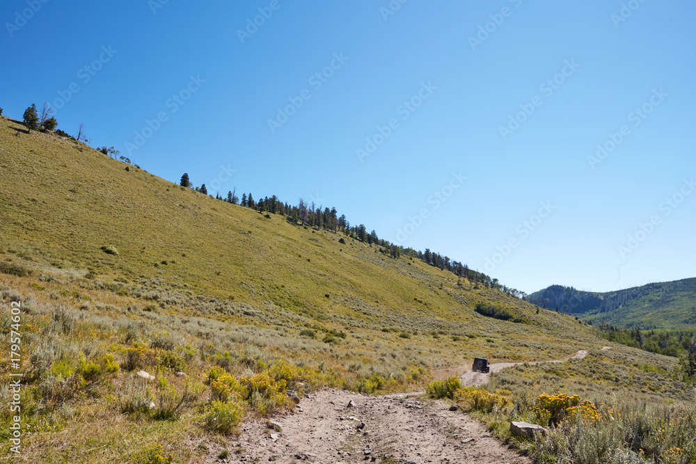 Scenic mountain scenery with a 4WD vehicle