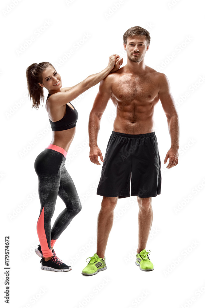 Sport, fitness, workout concept. Fit couple, strong muscular man and slim woman posing on a white background