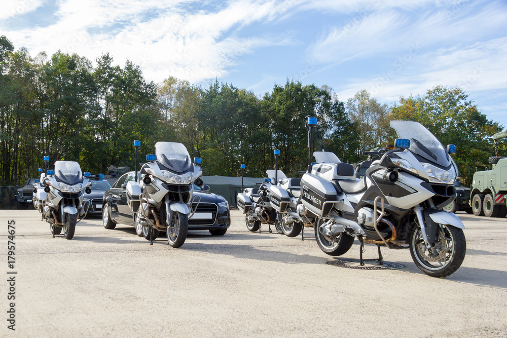 german feldjaeger, military police motorcycles and vehicles stands in formation
