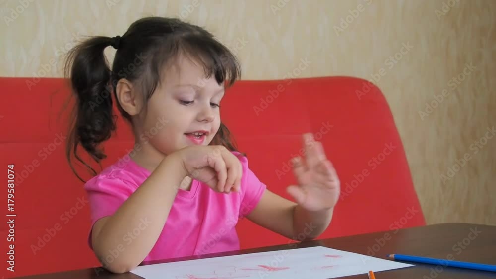 Emotions of the child. Happy little girl with colored pencils. Emotions of the child. Happy little girl with colored pencils.