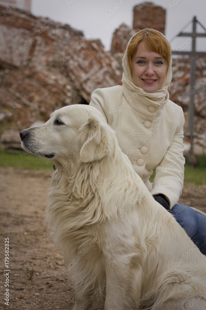 Girl and a white Labrador. Girl and a white Labrador.