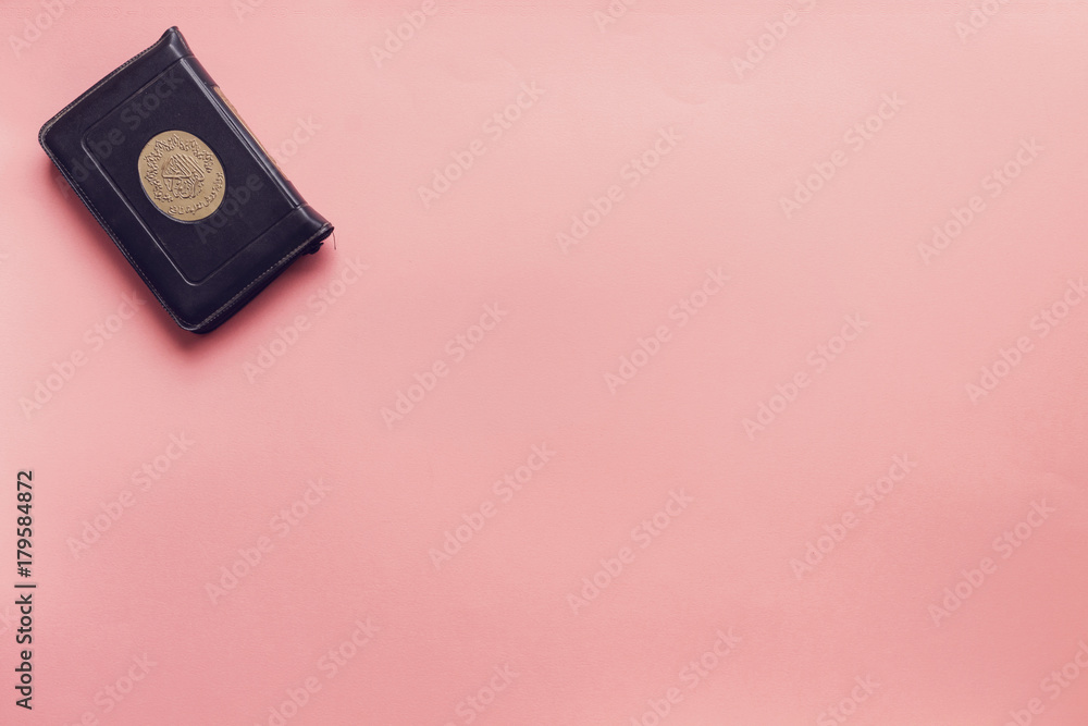 holy book of Muslims quran on pink background holy book of Muslims quran on pink background