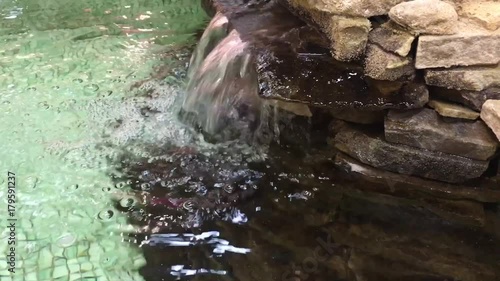 Decirative waterfall in mosaic waterpool