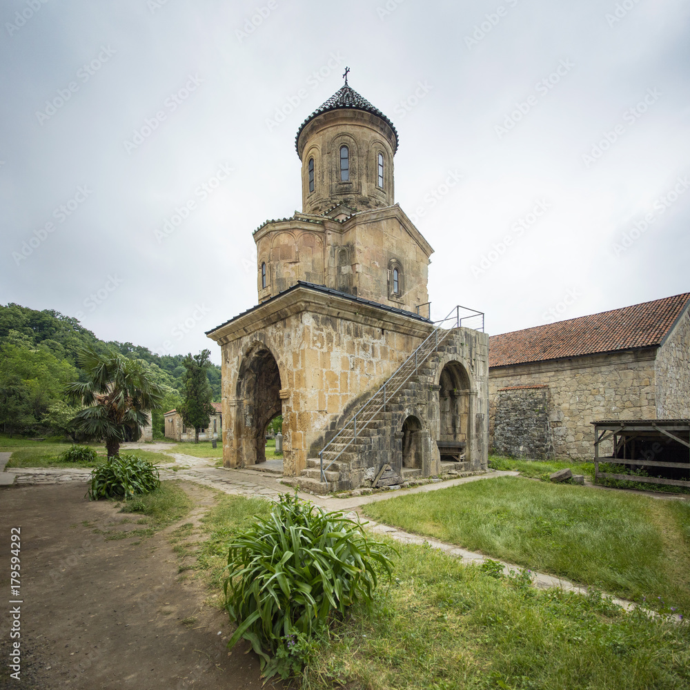 Fototapeta premium tower of old church in Georgia in cloudy day