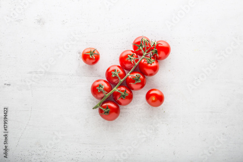 Top of view fresh tomatoes on white concrete background